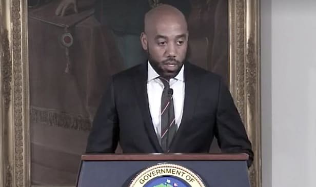Government House spokesman Richard Motta leads Mondayโs weekly press briefing. (Source photo by James Gardner)