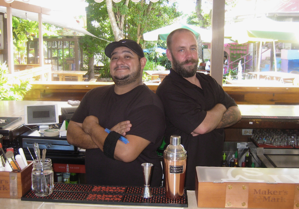 Proprietors Brandon Lutzy and Brian Cox man the bar at their new eatery, Whiskey Business. (Source photo by Teddi Davis)