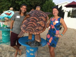 Chris and Sarah Lima show off the turtle he made and she wood-burned. (Source photo by Susan Ellis)