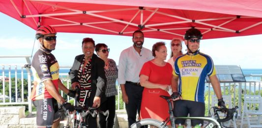 Joining the ribbon cutting for the new bike path on the Christiansted Bypass are bicyclist Mario Peters, AARP National Volunteer President Alicia Georges, AARP-VI State Volunteer President Corinne Plaskett, AARP-VI State Director Troy de Chabert-Shuster, AARP Chief Executive Officer Jo Ann Jenkins, Alma Winkfield of the V.I. Trail Alliance and bicyclist David Morales. (Source photo by Linda Morland)