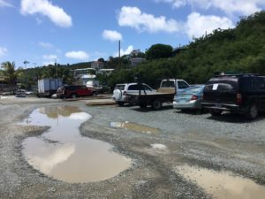 Several residents at the meeting brought up the recurring problem of flooding on the road adjacent to the gravel lot. (Source photo by Amy Roberts)