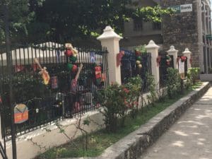 The fence of the park welcomed people with Christmas decorations. (Source photo by Susan Ellis)