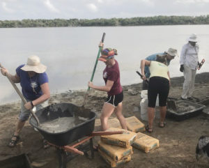 Volunteers mix concrete for the bird blind. (Contributed photo by Romina Ramos)