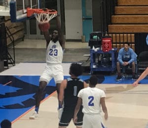 Muhammadu Jawuru slams the ball home for UVI. (Source photo by Kyle Murphy)