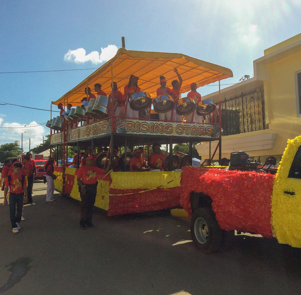 The Rising Stars steel orchestra rocks and rolls down the parade route. (Source photo by Don Buchanan)