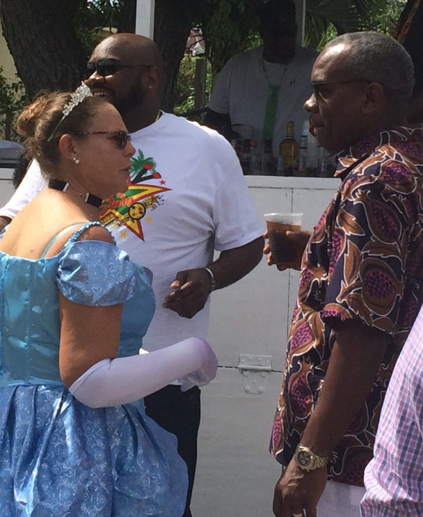 Sue Lakos talks with Gov. Albert Bryan on the parade route. (Source photo by Don Buchanan)