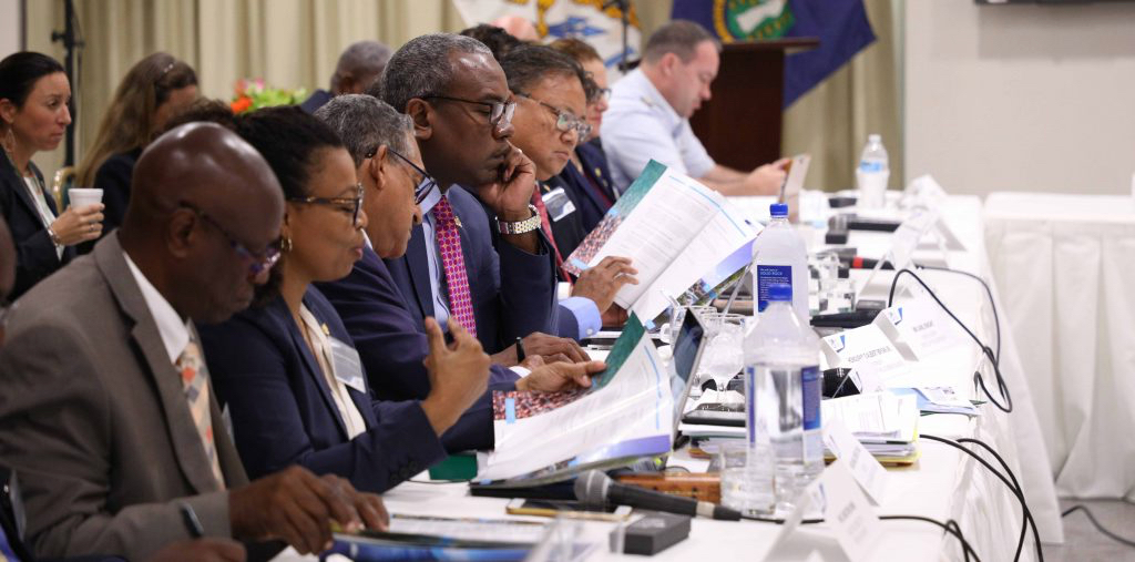 Officials from the USVI flank Gov. Albert Bryan at Tuesday's Inter-Virgin Islands Council meeting. (Government House photo)