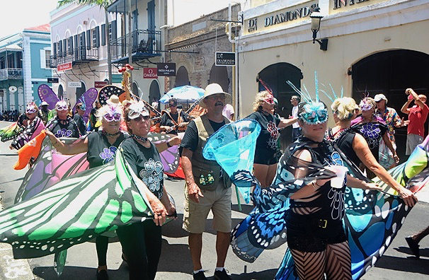 "Butterflies" journey through the streets, greeting the Carnival crowd. (File photo)