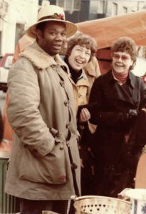 Eddie Donoghue poses with some patrons at an outdoor market in Sweden in 1970. (Photo provided by Edwin L. Martin)