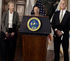 Dr. Esther Ellis talks about the Coronavirus, flanked by Francine Lang and Daryl Jaschen. (Source photo by Susan Ellis)