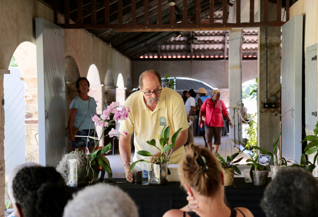 Thomas Kash, a St. Croix Orchid Society member presents “Growing Orchids Using Semi-Hydroponics” to an interested audience. This was one of five workshops offered during the three day show. (Source photo by Linda Morland)