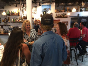 Valerie Sims greets guests at a book signing held at Bajo El Sol last Saturday. (Source photo by Amy Roberts)