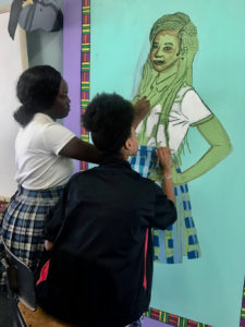 From left, Gelysia Anderson and Era Daniel work on Kehinde Wiley-inspired art. (Photo submitted by Danica David)