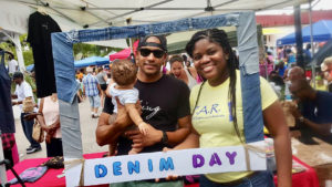 Gabriel A. Stephen, Su-Layne Walker and baby pose with the Denim Day frame at the 2017 St. Thomas Carnival Denim Day 2017. (Photo by Vernon Araujo)