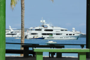 A super yacht as seen through the supports of a Magens Bay shed. ((Source photo by S. Pennington)