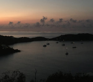 Mast lights shine above boats as the sun rises over the normally empty Rendezvous Bay on St. John’s south side. (Photo by Amy Roberts)