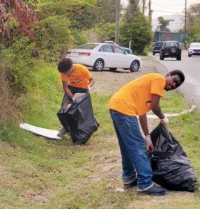 Members of the cleanup place bag roadside trash. (Photo provided by Jody Olsen)