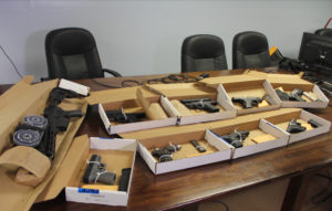 Police display the captured weapons at Tuesday's news conference. (VIPD photo)