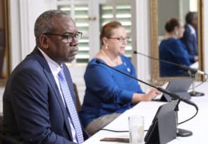 File photo shows Gov. Albert Bryan Jr. with Health Commissioner Justa E. Encarnacion. On Monday Bryan called on the Senate to approve a 60-day extension to the current State of Emergency declaration. (Government House photo)