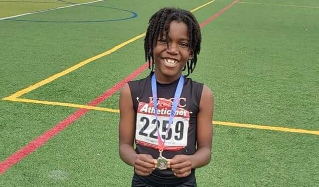 LeSotho Golphin of St. Croix with the silver medal he won in the long jump at the AAU Central District Qualifier Track & Field Meet in Chicago. (Photo courtesy of the Hounds and Foxes Track Club)