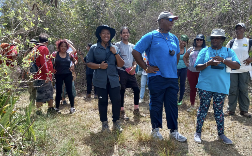 Leading a hike with teachers, archaeologists, medical doctors, parents, grandparents, students, hikers, etc., at Maroon Ridge for Emancipation Day. (Photo by Olasee Davis)