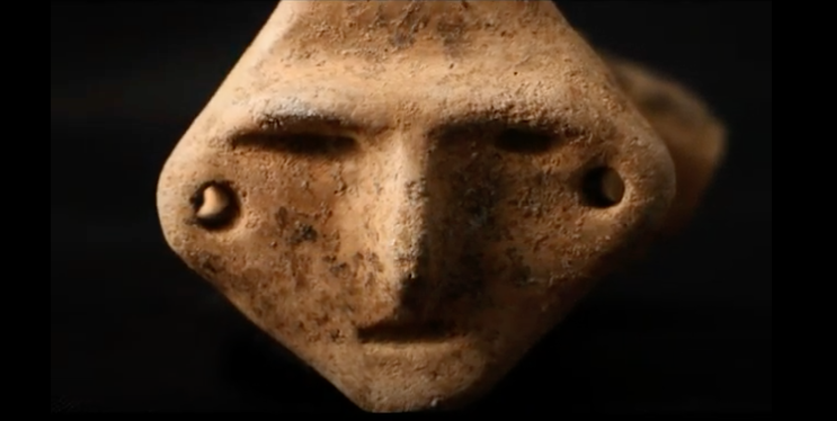 A ceramic fragment with the image of a face was found on Main Steet. (Screenshot from The Charlotte Amalie Saladoid Excavation Documentary)