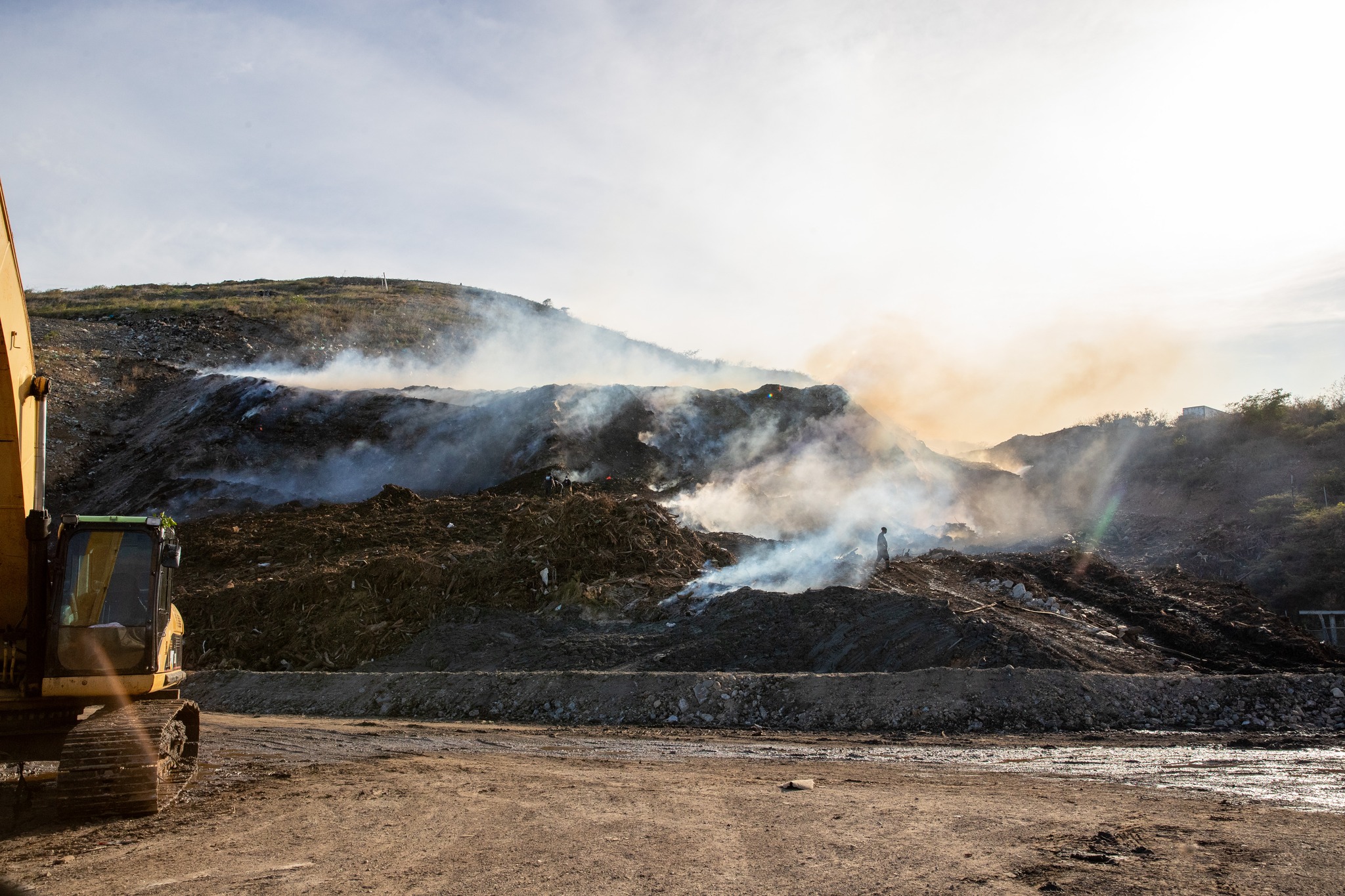 Smoke wafts from the Bovoni landfill fire on St. Thomas that erupted on Sept. 14 in a green waste section that contains plant debris from Hurricane Irma. (Photo courtesy Government House)