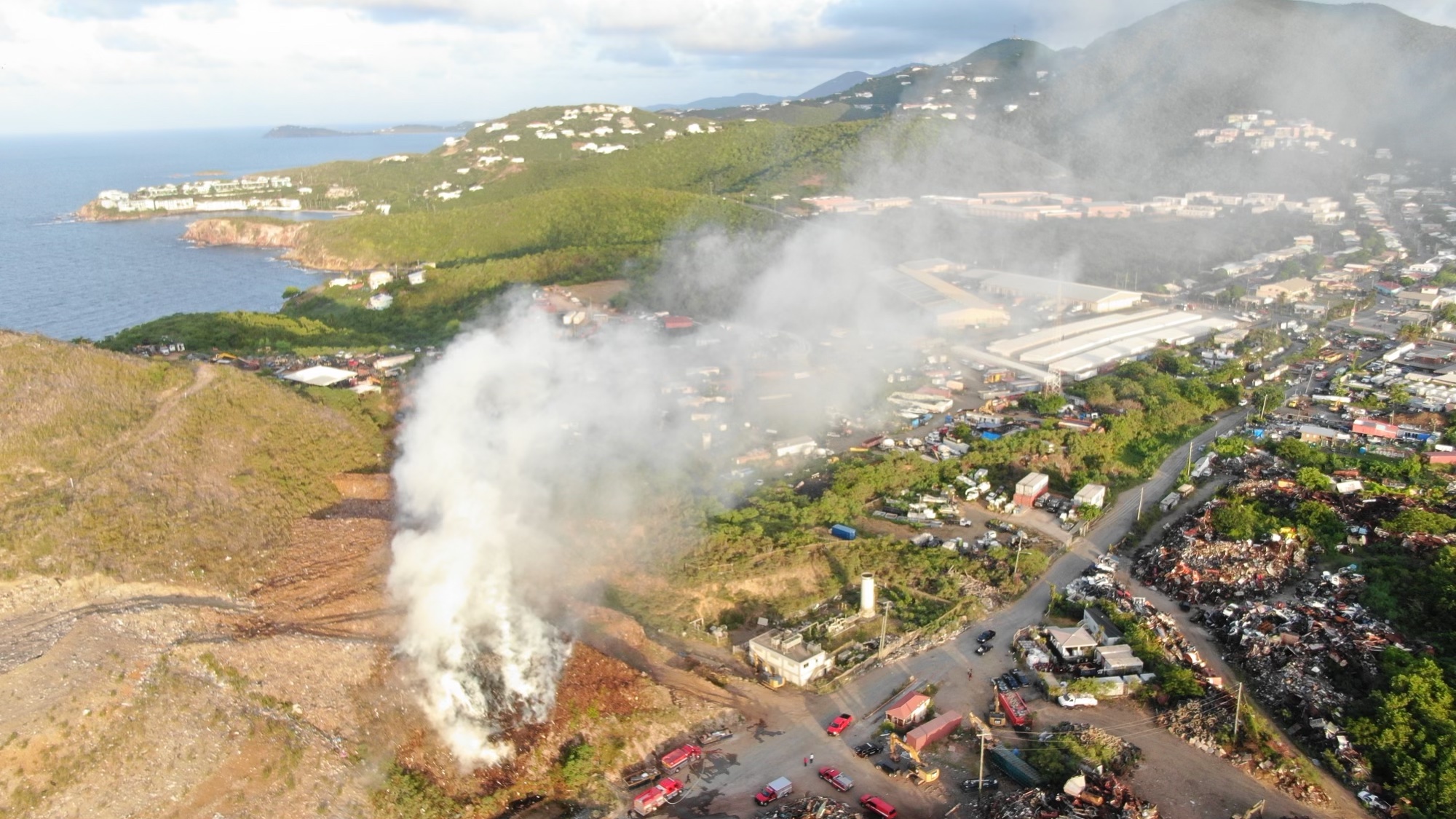 Heavy smoke pours from a fire that broke out early Thursday at the Bovoni landfill on St. Thomas. (Photo courtesy V.I. Fire and Emergency Medical Services)