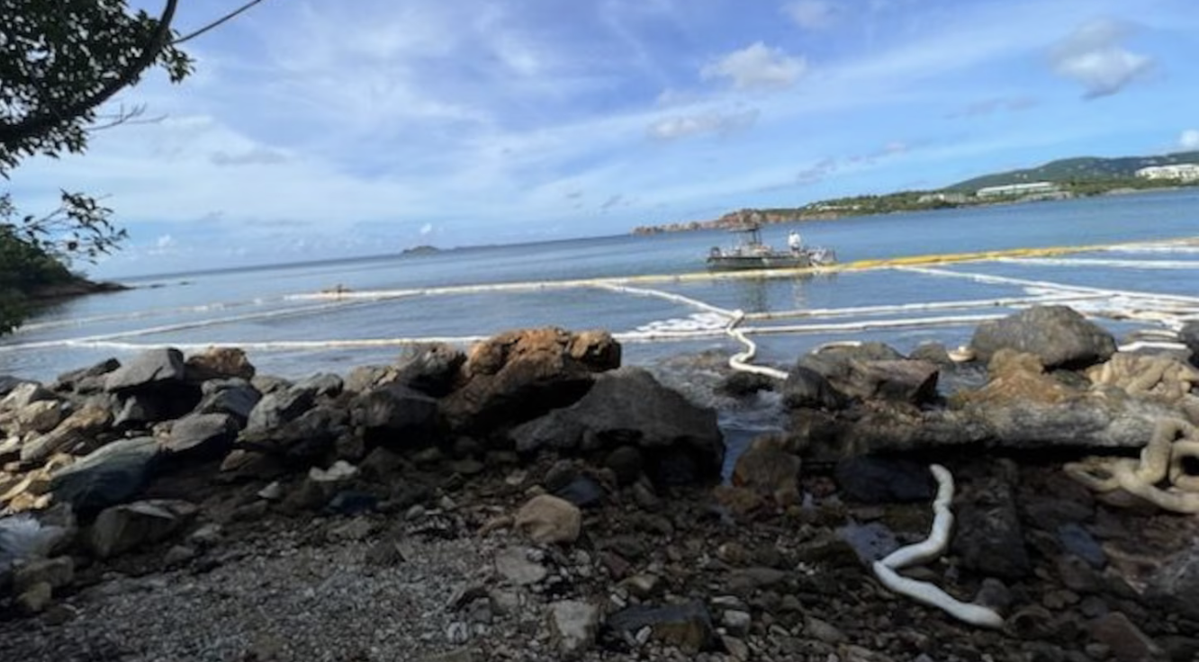 The V.I. Water and Power Authority has set up a containment and absorbent recovery boom on the eastern shore of Lindbergh Bay on St. Thomas to collect oil that Coast Guard discovered in the water near the Randolph Harley Power Plant. (Coast Guard photo)