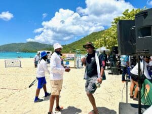 Gov. Albert Bryan Jr. and Calvert White, commissioner of the Sports, Parks and Recreation Department preparing to present one of the winning teams with an award. (Source photo by Nyomi Gumbs)