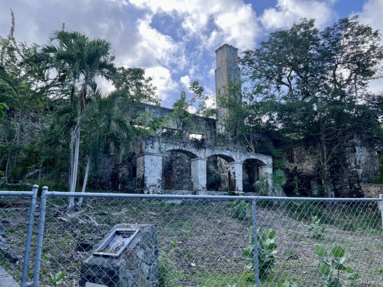 Visitors heading to the main beach at Caneel Bay pass by the impressive ruins of the sugar mill. (Source file photo)