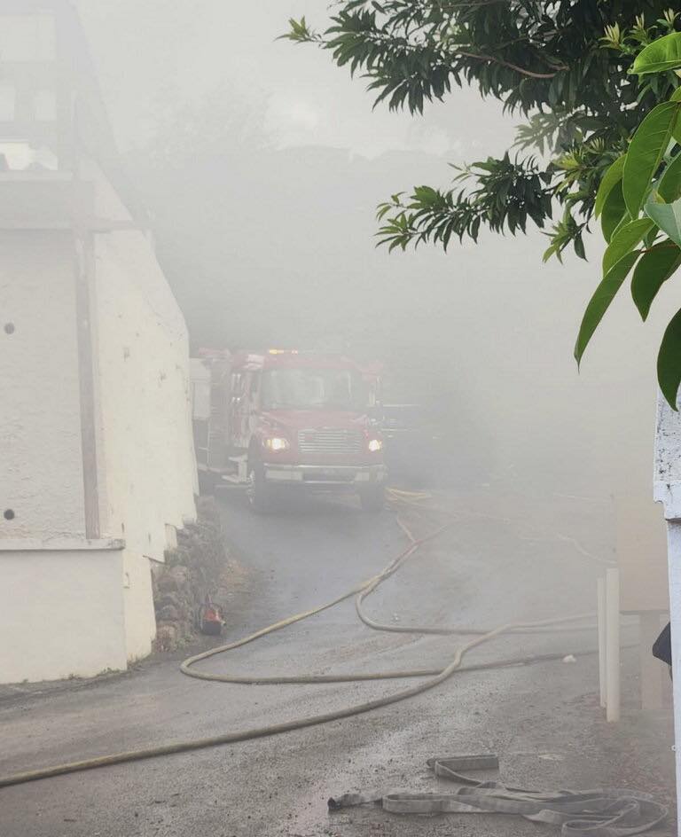 Smoke engulfs a fire truck responding to a blaze at the Blackbeard's Castle Apartments early Wednesday on St. Thomas. (Photo courtesy VI Fire and Emergency Medical Services)